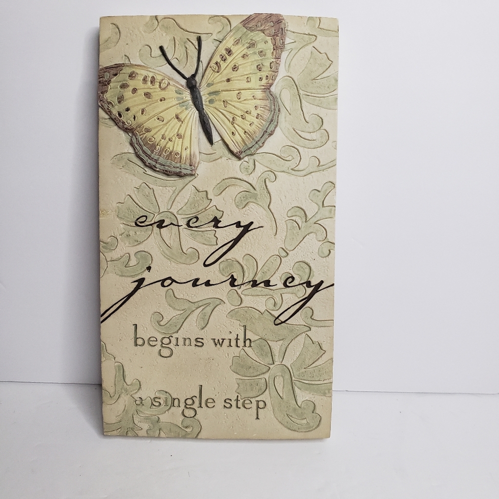 Decorative tile featuring a butterfly. 217